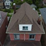 Aerial view of a residential home in Wexford, PA, showcasing a well-maintained roof and siding, emphasizing the importance of exterior upkeep for longevity and protection from the elements.