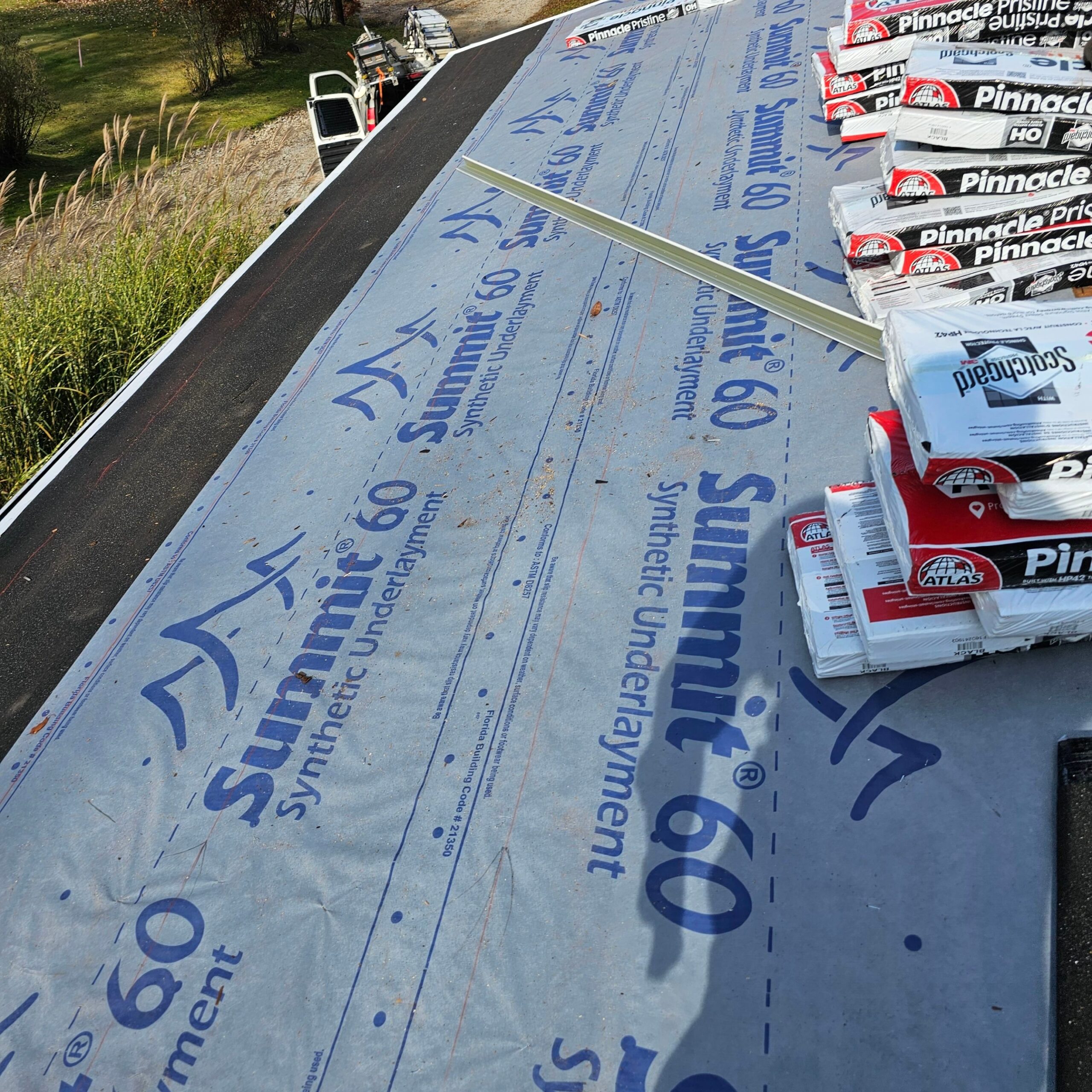 Summit 60 synthetic underlayment and Atlas Pinnacle roofing materials on a residential roof during installation in Natrona Heights, highlighting quality components for a complete exterior upgrade.