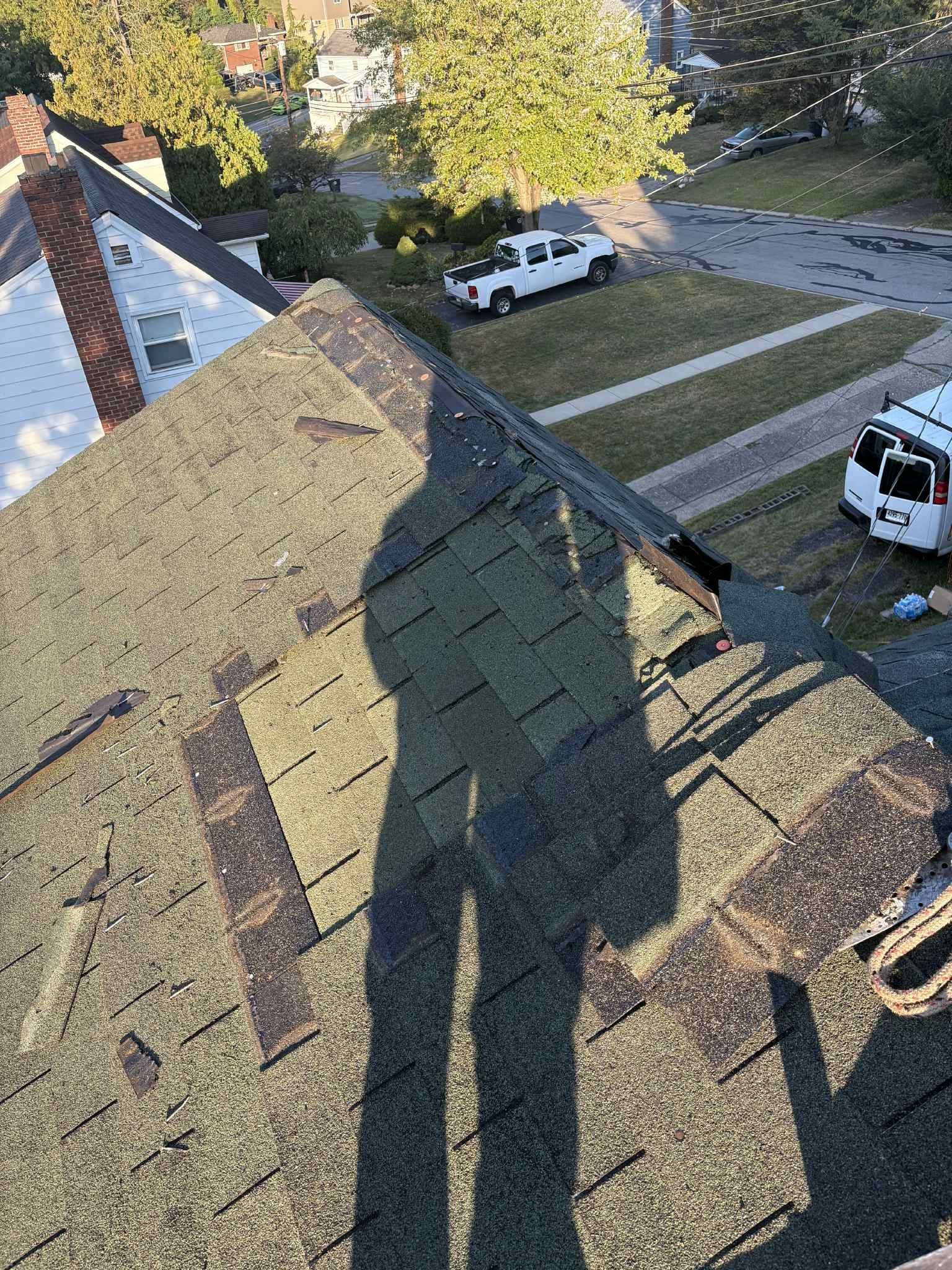 Old weathered shingles on a roof slope before tearoff in Pittsburgh, Alan Construction