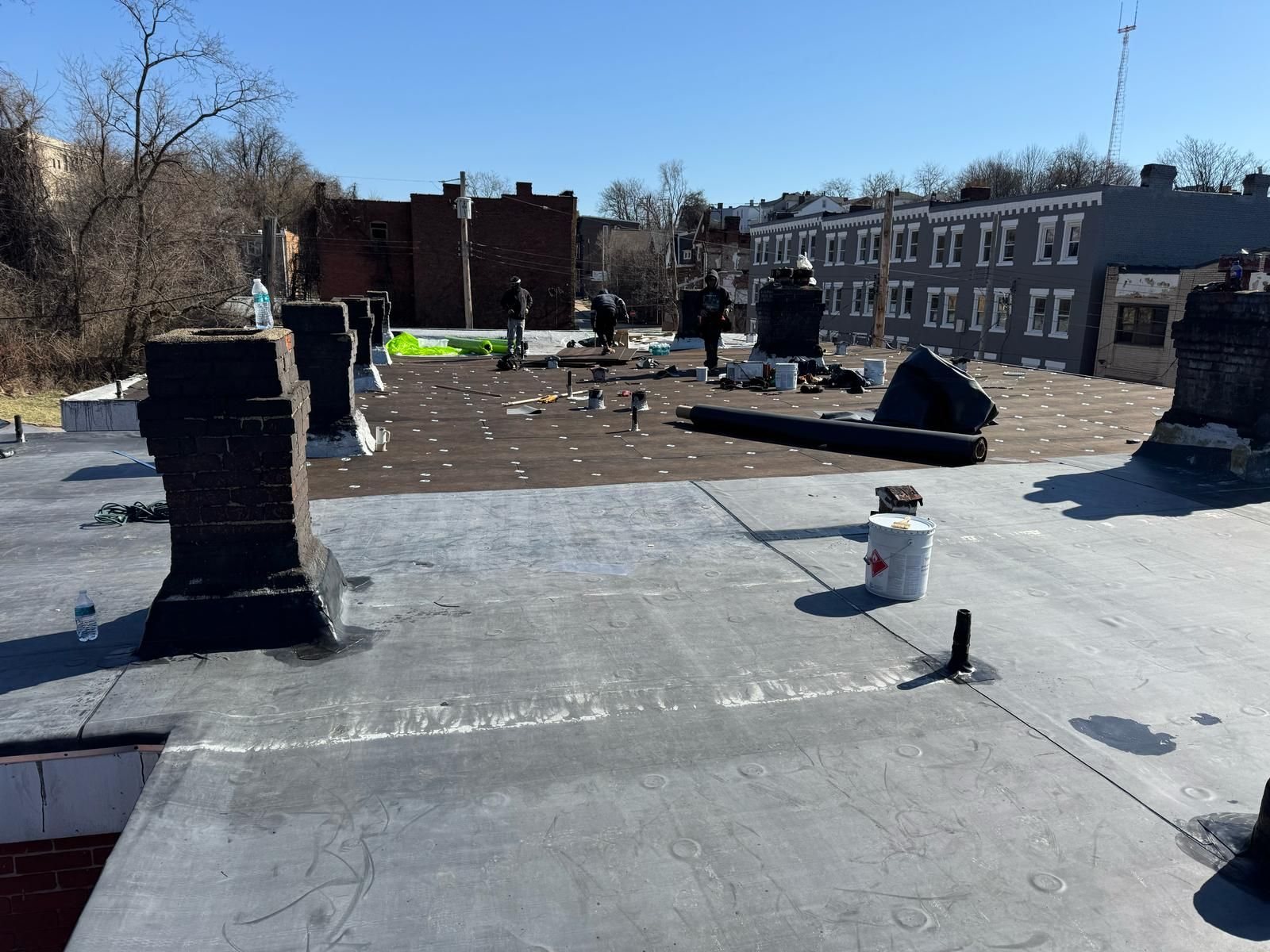 New flat rubber roof with chimneys and vent pipes in Pittsburgh, Alan Construction