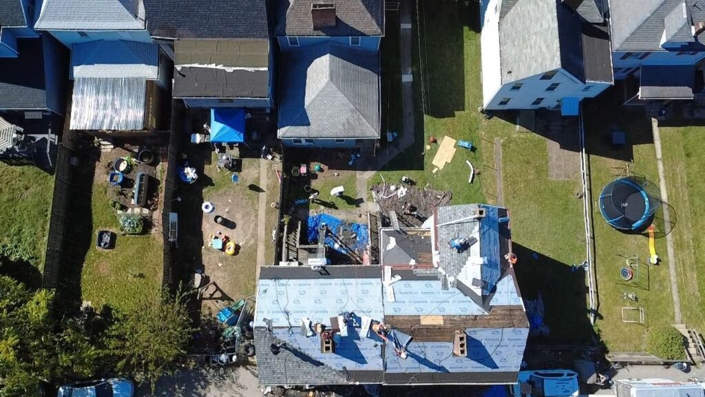 Drone view of underlayment going down across the Glassport roof