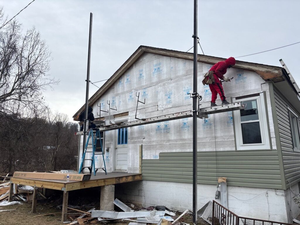 House wrap going on during a Monongahela siding replacement