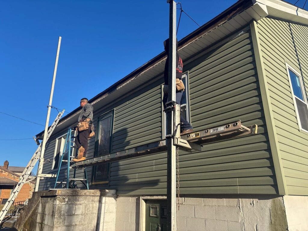 Crew installing vinyl siding