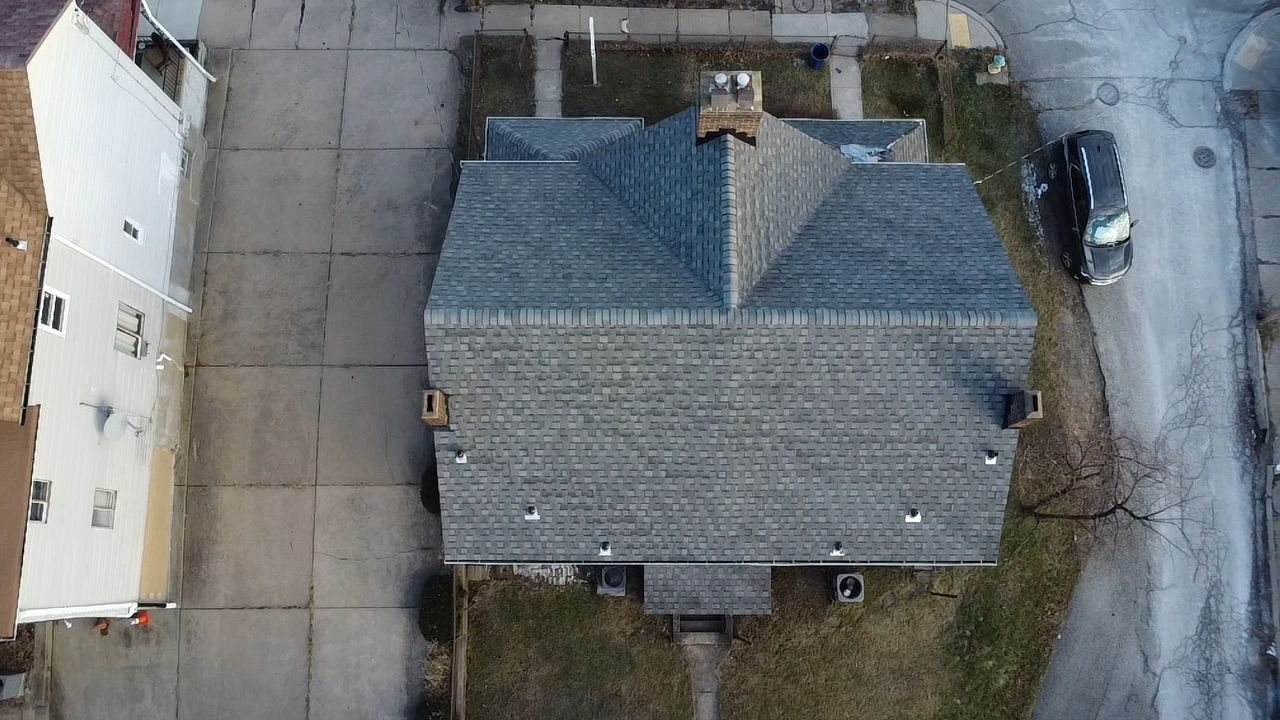 Top down drone view of a finished gray shingle roof in Pittsburgh, Alan Construction