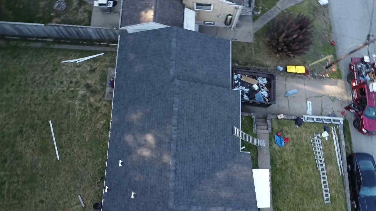 Drone view of a completed gray shingle roof on a house in Pittsburgh, Alan Construction