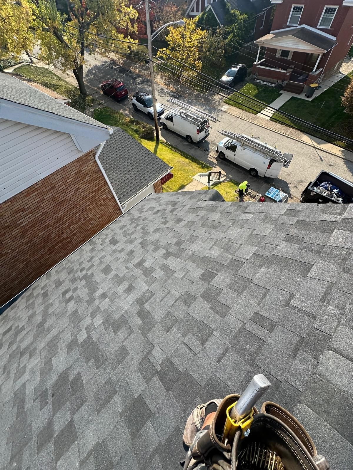 New gray architectural shingles on a sloped roof in Pittsburgh, Alan Construction