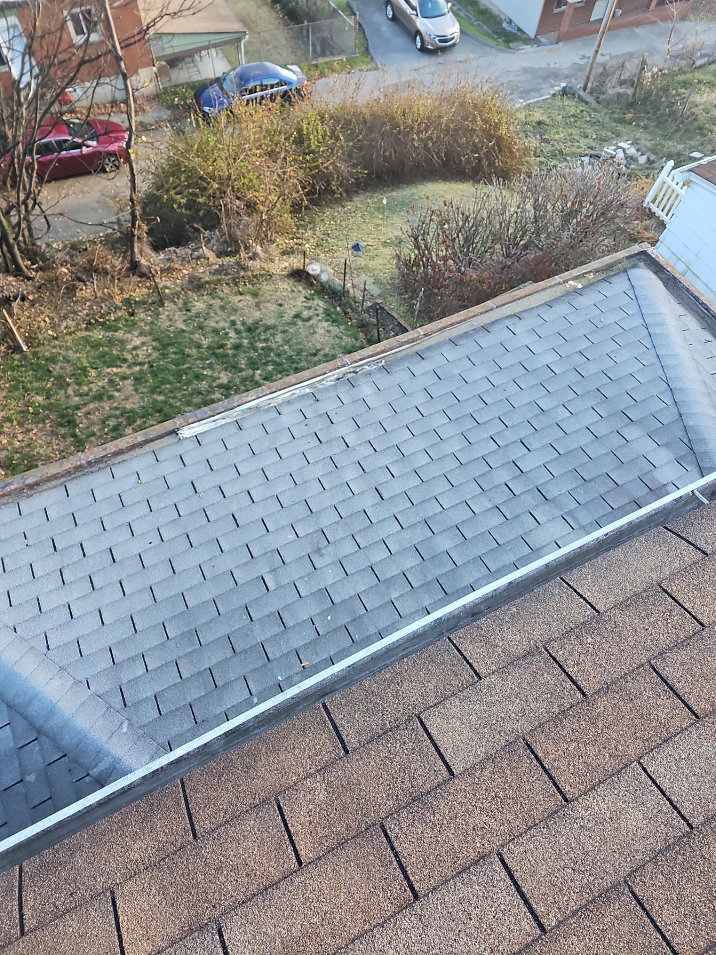 Metal drip edge along the eave of a brown shingle roof in Pittsburgh, Alan Construction