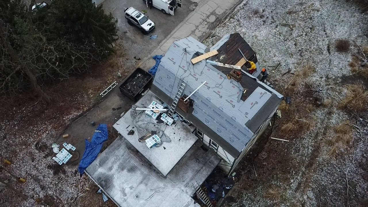 Drone view of a roof in progress with underlayment and plywood in Pittsburgh, Alan Construction