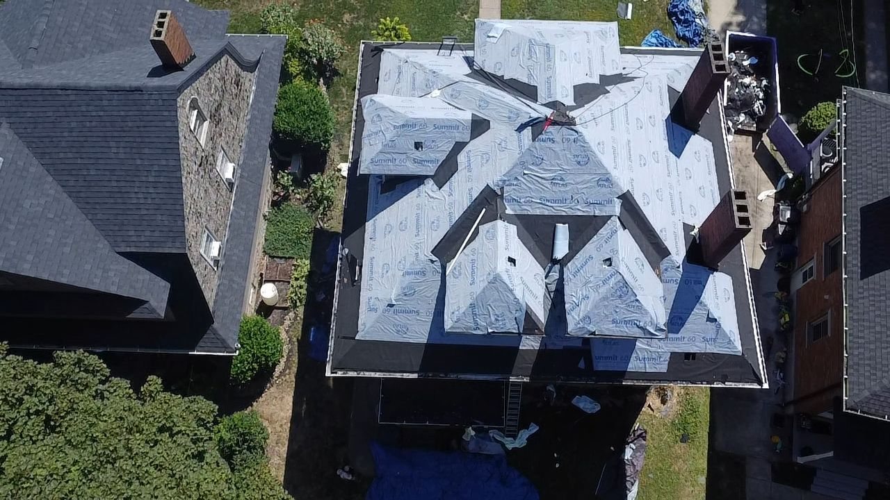 Overhead view of a hip roof with many dormers in underlayment in Pittsburgh, Alan Construction