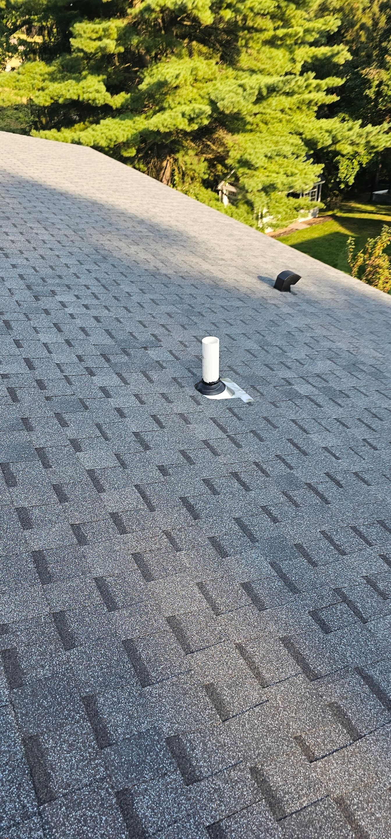 Pipe vent boot set into new gray shingles in Bethel Park, Alan Construction
