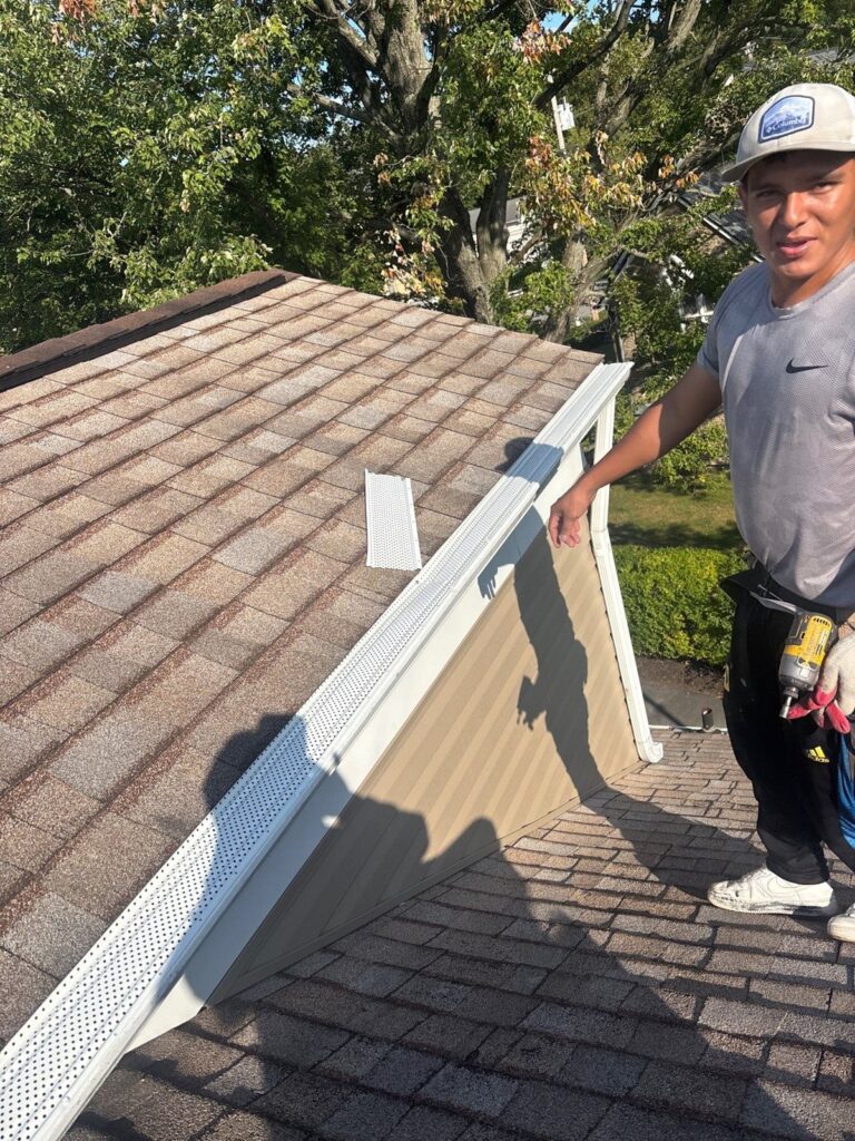 New gutter being installed on a Scott Township home