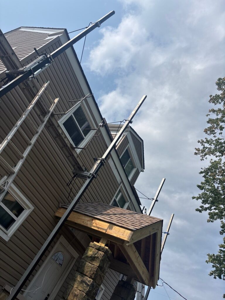 Siding work underway on a Scott Township home