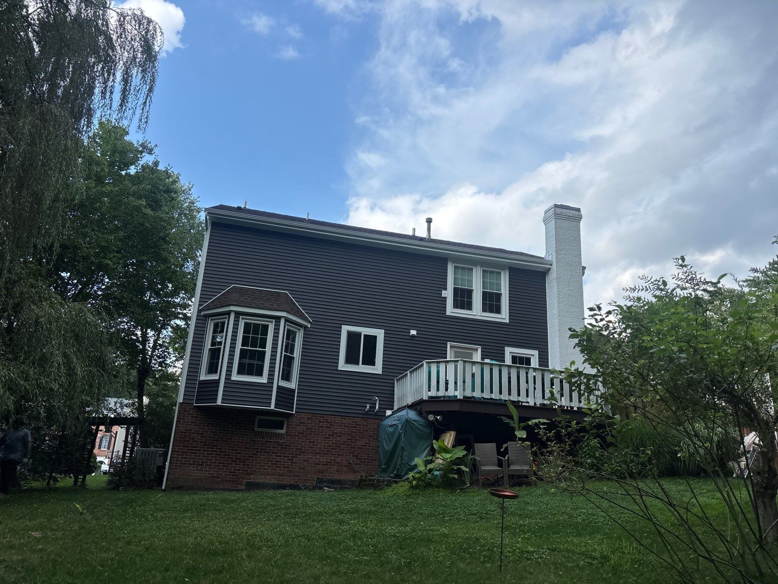 Back of a home with dark gray siding and white trim in Pittsburgh, Alan Construction