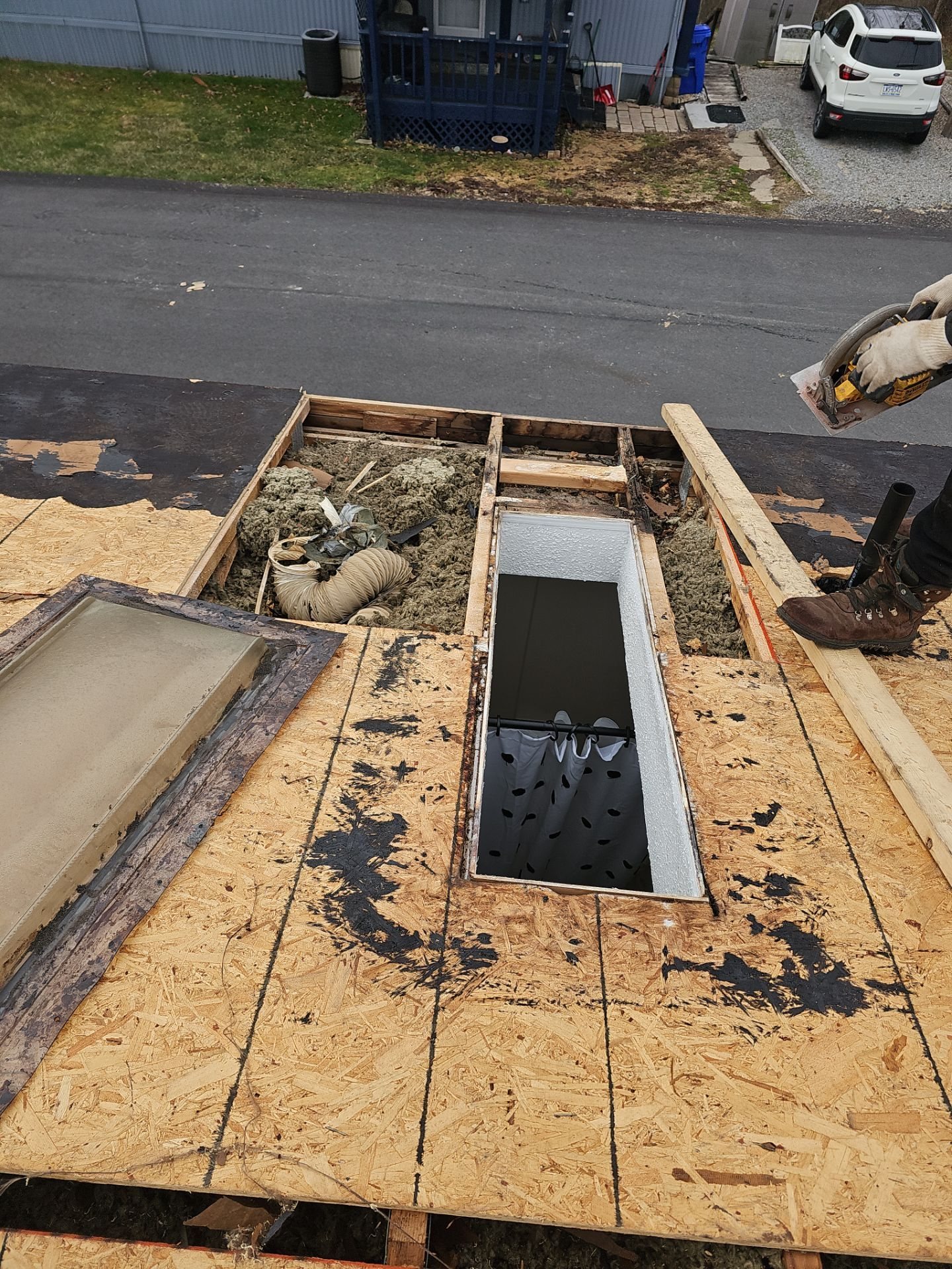 Skylight opening framed in new OSB roof decking in Oakdale, Alan Construction