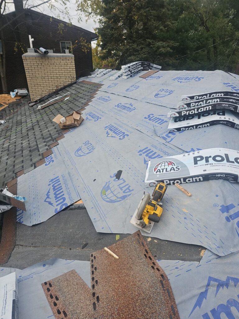 Old shingles coming off around the chimney on a Mount Lebanon roof
