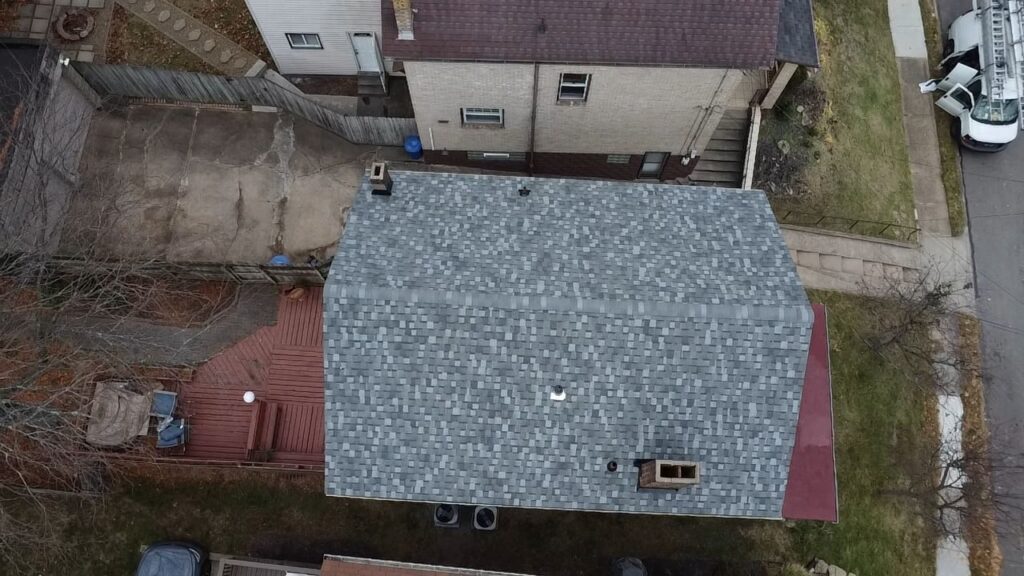 New Squirrel Hill roof among the neighboring houses
