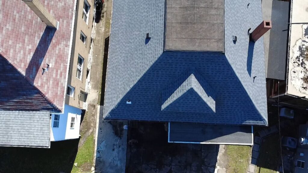 New roof on a Squirrel Hill home beside neighboring roofs