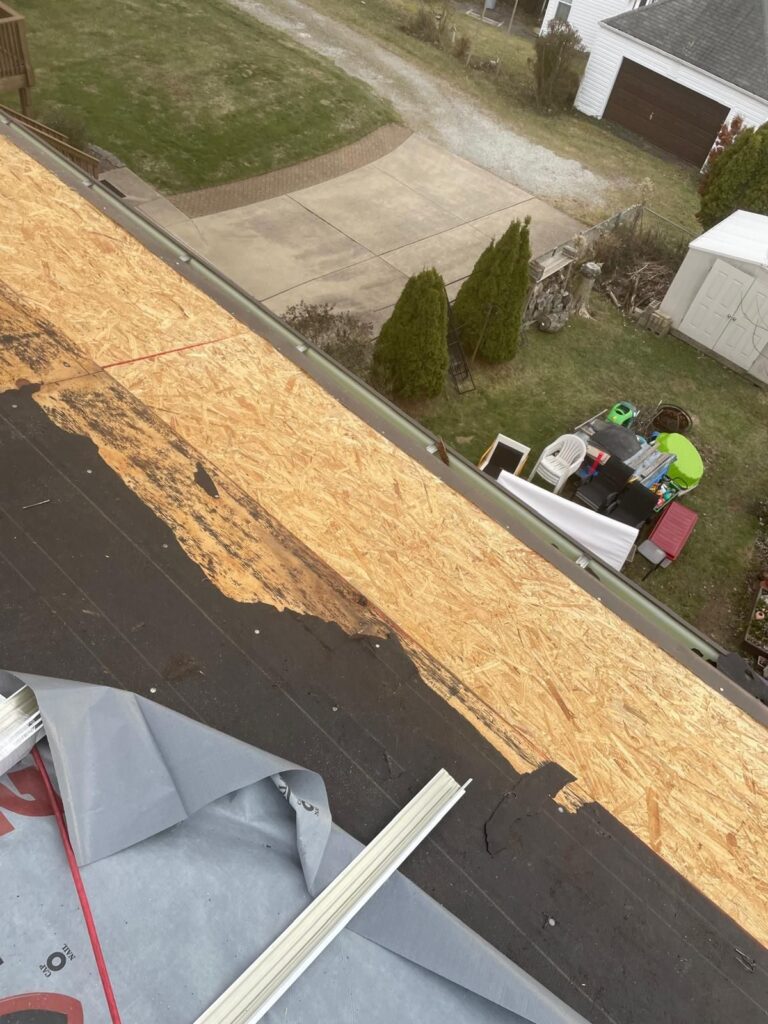 New decking going down at the eave of a Whitehall roof