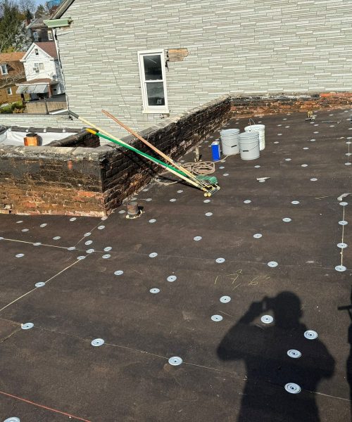 Fiber board fastened over the deck before the rubber roof in Allentown
