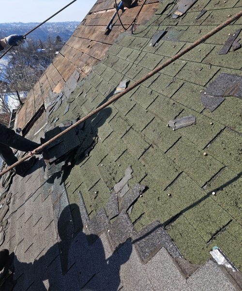 Worn shingles on a Pittsburgh roof before replacement